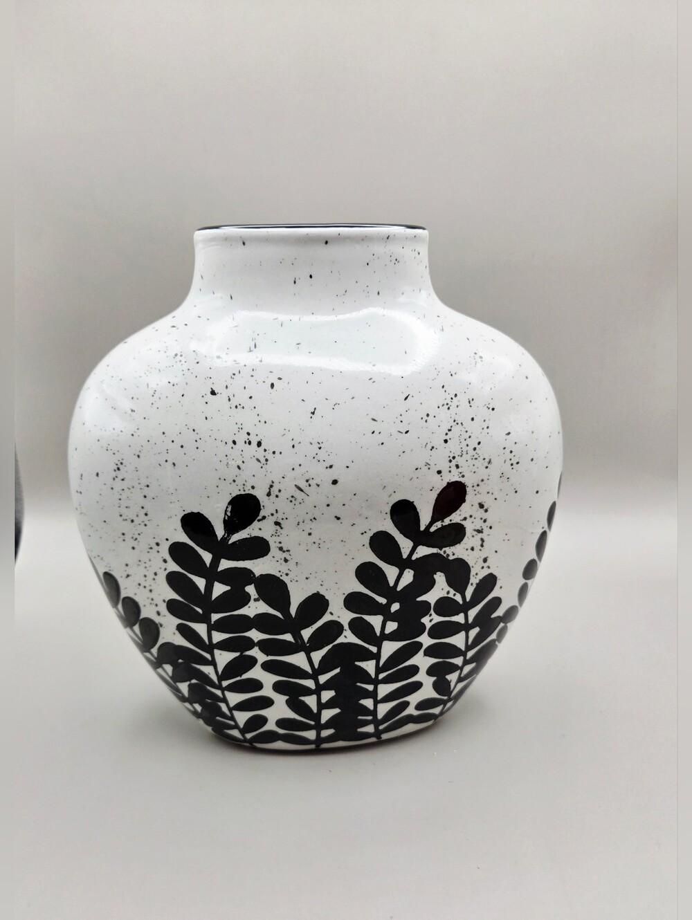 Hand-Painted White Ceramic Vase with Black Leaf Motif